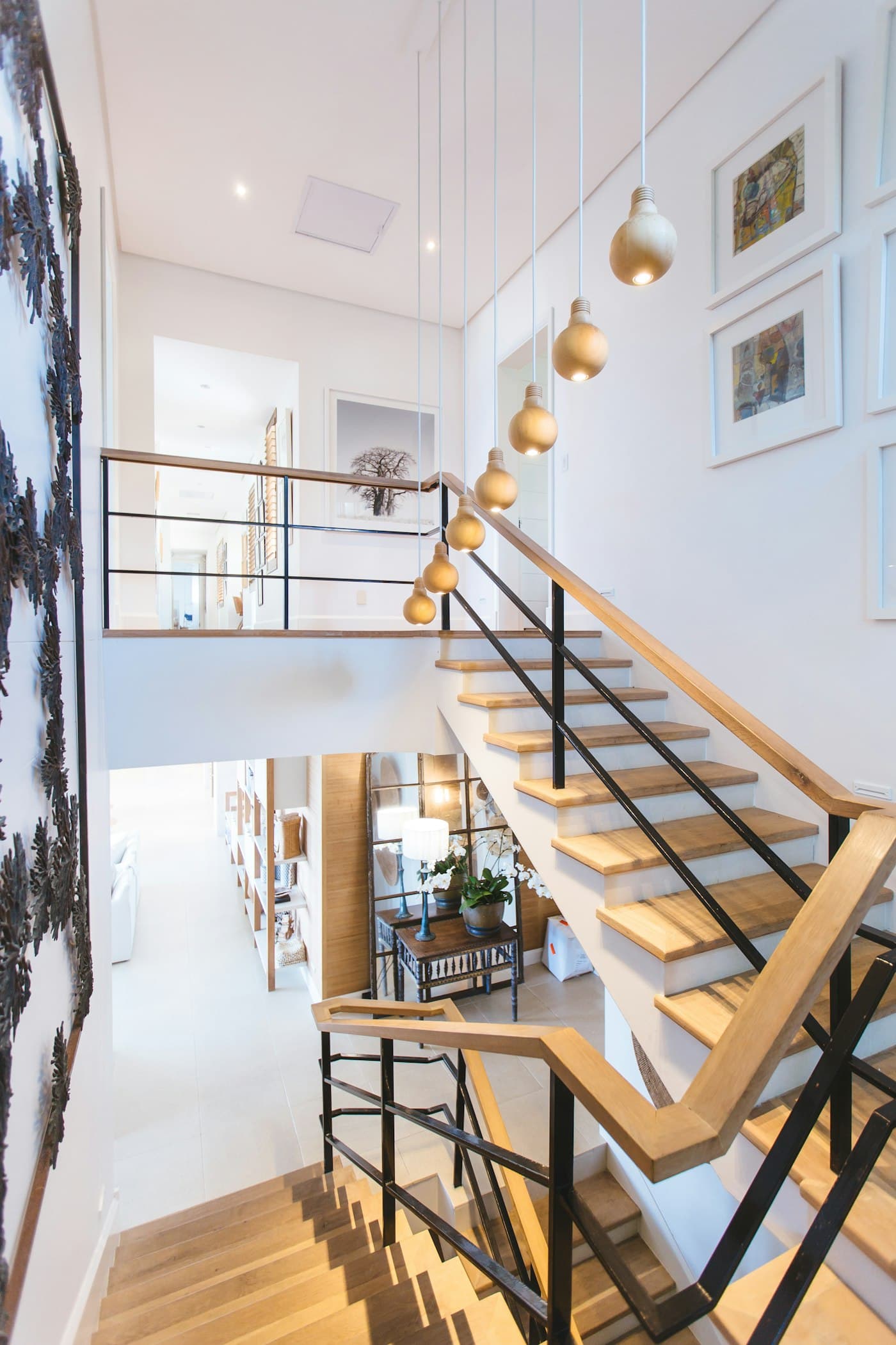 A bright residential stairwell and hallway in a member's home.